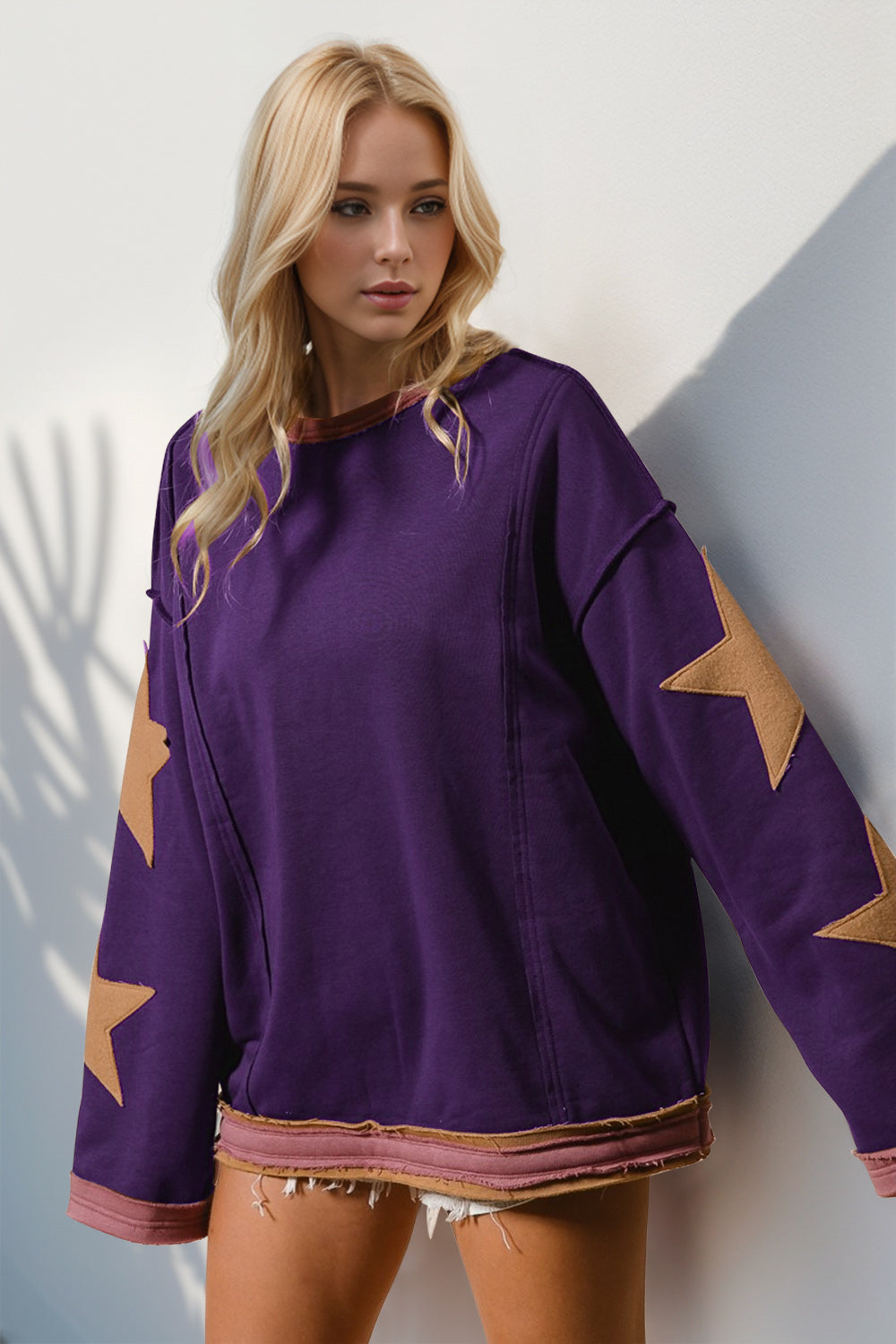 Boho Western Star Patch Sweatshirt – A Little Dust, A Lot of Stars. Add some star power to your sweatshirt collection with this long-sleeve star patched sweatshirt. Made from super-soft cotton, it’s got that laid-back vibe with a slouchy fit, oversized star details, and raw trim for a little extra edge. Whether you’re layering or wearing it solo, this sweatshirt brings effortless cool to any outfit!