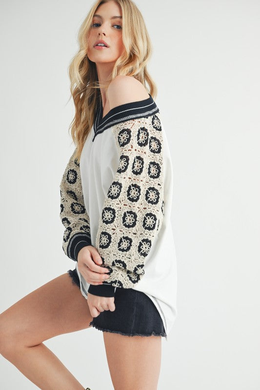 Crochet Contrast Stitching V Neck Top -ivory. The Crochet Contrast Stitching V-Neck Top is a feminine top that features intricate crochet detailing and contrasting stitching along the neckline.
Perfect for adding a touch of bohemian charm to your outfit.
V-neck design adds a flattering silhouette.