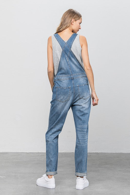 Denim Lab- Patch Pocket Ripped Denim Overalls -Day to Night- Season-to Season. So essential and always timeless, these overalls are a must-have that your wardrobe has been waiting for! These distressed overalls have vintage appeal and for a casual outing you can wear just about anything! Worried it is too laid back? To take it from day to night simply dress up with a polished top, fitted sweater, or structured blazer with heels or ankle boots! By the way, straps are adjustable!