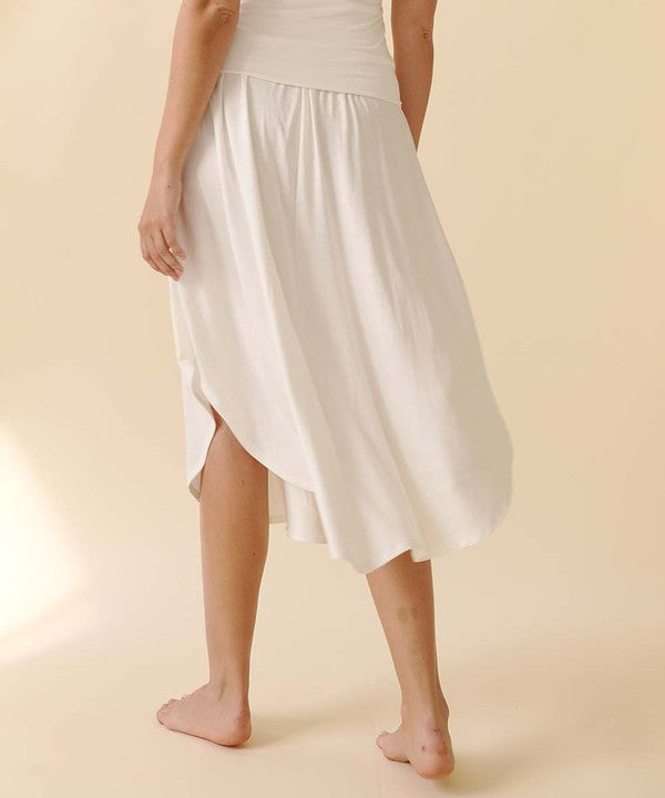 Experience ultimate comfort and effortless style with our luxurious Organic Bamboo Maxi Skirt. Crafted from a dreamy blend of organic bamboo and soft, stretchy spandex, this skirt offers an incredible drape and moves with you, offering a flattering fit that feels as good as it looks. The smocked elastic waist hugs gently, giving you all-day ease, while the flowing silhouette adds a graceful, boho touch to any outfit. This is a savvy choice for those who are eco-friendly or have skin conditions.