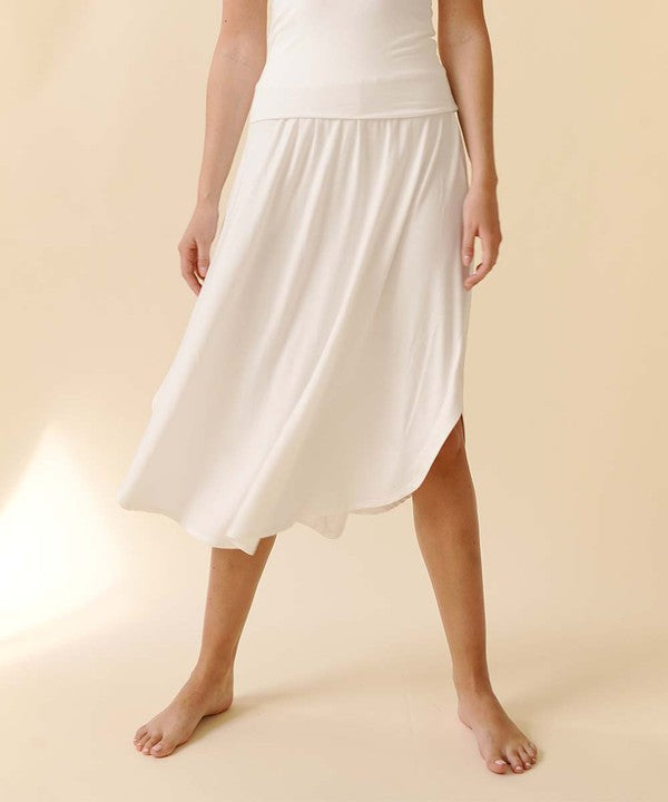 Experience ultimate comfort and effortless style with our luxurious Organic Bamboo Maxi Skirt. Crafted from a dreamy blend of organic bamboo and soft, stretchy spandex, this skirt offers an incredible drape and moves with you, offering a flattering fit that feels as good as it looks. The smocked elastic waist hugs gently, giving you all-day ease, while the flowing silhouette adds a graceful, boho touch to any outfit. This is a savvy choice for those who are eco-friendly or have skin conditions.