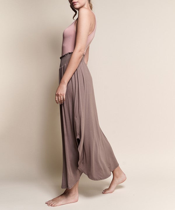 Experience ultimate comfort and effortless style with our luxurious Organic Bamboo Maxi Skirt. Crafted from a dreamy blend of organic bamboo and soft, stretchy spandex, this skirt offers an incredible drape and moves with you, offering a flattering fit that feels as good as it looks. The smocked elastic waist hugs gently, giving you all-day ease, while the flowing silhouette adds a graceful, boho touch to any outfit. This is a savvy choice for those who are eco-friendly or have skin conditions.