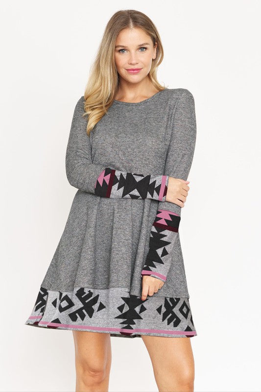 Layered Fit and Flare Dress- "Flatter Every Curve, Own Every Moment!. This dress transition easily between settings, from office to party attire, with the right accessories! Pair with your favorite boots. This flared dress is both cozy and chic. Aztec trim.
