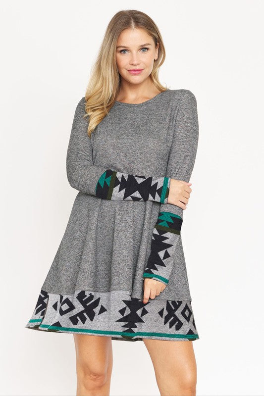 Layered Fit and Flare Dress- "Flatter Every Curve, Own Every Moment!. This dress transition easily between settings, from office to party attire, with the right accessories! Pair with your favorite boots. This flared dress is both cozy and chic. Aztec trim.
