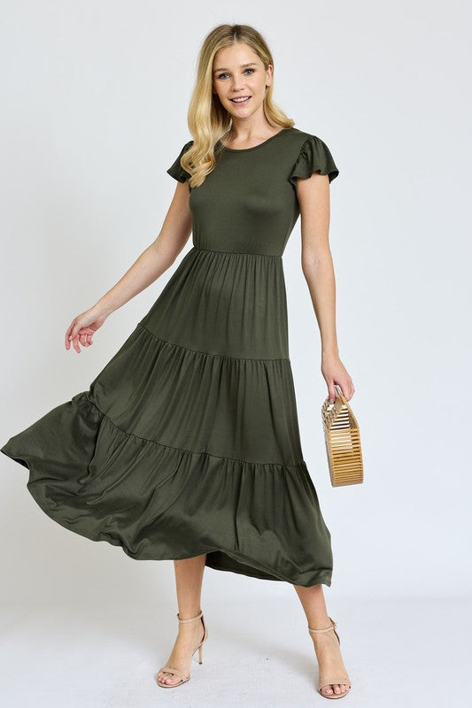 This Solid Flutter Sleeve Tiered Tea Length Dress was designed with you in mind!
Step into a thoughtfully designed dress to complement your curves and highlight your natural beauty. The soft, stretch fabric hugs in all the right places, offering all-day comfort taking you confidently from morning to night. Whether you are enjoying a garden party, or having a casual afternoon out, this dress has the versatility to be that go-to for many types of events.