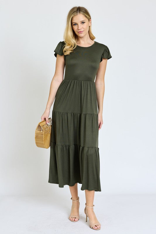 This Solid Flutter Sleeve Tiered Tea Length Dress was designed with you in mind!
Step into a thoughtfully designed dress to complement your curves and highlight your natural beauty. The soft, stretch fabric hugs in all the right places, offering all-day comfort taking you confidently from morning to night. Whether you are enjoying a garden party, or having a casual afternoon out, this dress has the versatility to be that go-to for many types of events.