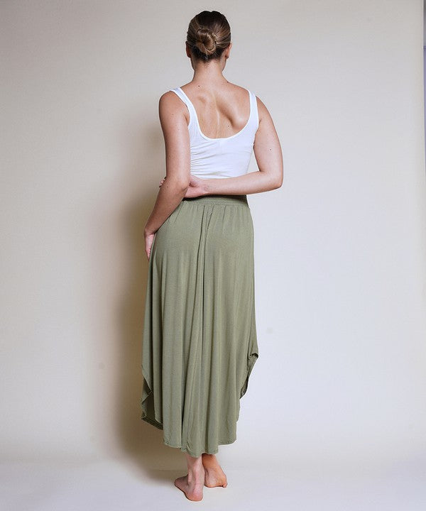 Experience ultimate comfort and effortless style with our luxurious Organic Bamboo Maxi Skirt. Crafted from a dreamy blend of organic bamboo and soft, stretchy spandex, this skirt offers an incredible drape and moves with you, offering a flattering fit that feels as good as it looks. The smocked elastic waist hugs gently, giving you all-day ease, while the flowing silhouette adds a graceful, boho touch to any outfit. This is a savvy choice for those who are eco-friendly or have skin conditions.