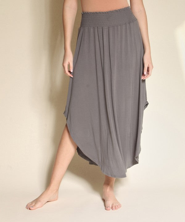 Experience ultimate comfort and effortless style with our luxurious Organic Bamboo Maxi Skirt. Crafted from a dreamy blend of organic bamboo and soft, stretchy spandex, this skirt offers an incredible drape and moves with you, offering a flattering fit that feels as good as it looks. The smocked elastic waist hugs gently, giving you all-day ease, while the flowing silhouette adds a graceful, boho touch to any outfit. This is a savvy choice for those who are eco-friendly or have skin conditions.