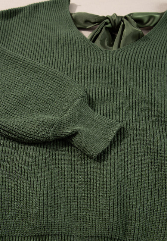 Thick and comfy feminine V-neck sweater. You can choose between (or get both) two gorgeous colors: a creamy beige and a hunter dark green. What else make's this long sleeve different? The feminine tied back bow! This long sleeve sweater can be casual and carefree during the day and dressed up at night. Enjoy the bit of sexy edginess!