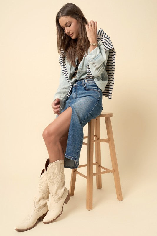 Get ready for your next event with this rustic jean skirt, with a flattering midi length that’s as comfy as it is stylish. The crossover design adds a modern twist while still keeping that fun, western spirit. Whether you're headed to a country concert, weekend market, or a casual night out with friends, this skirt has you covered.