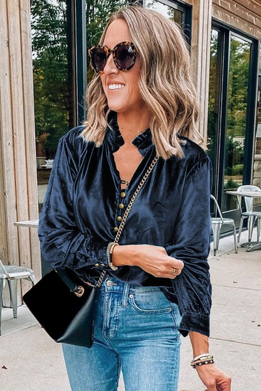 This luxurious velvet blouse is soft, skin-friendly, and lightweight, offering both comfort and elegance. Featuring a classic V-neck, button design, and feminine frilled neckline, it adds a timeless touch to your wardrobe. Perfectly paired with jeans, leggings, skirts, or boots, this versatile top is ideal for any occasion—whether casual, office, or a night out.. Several stunning colors available. All you need to do is pick!