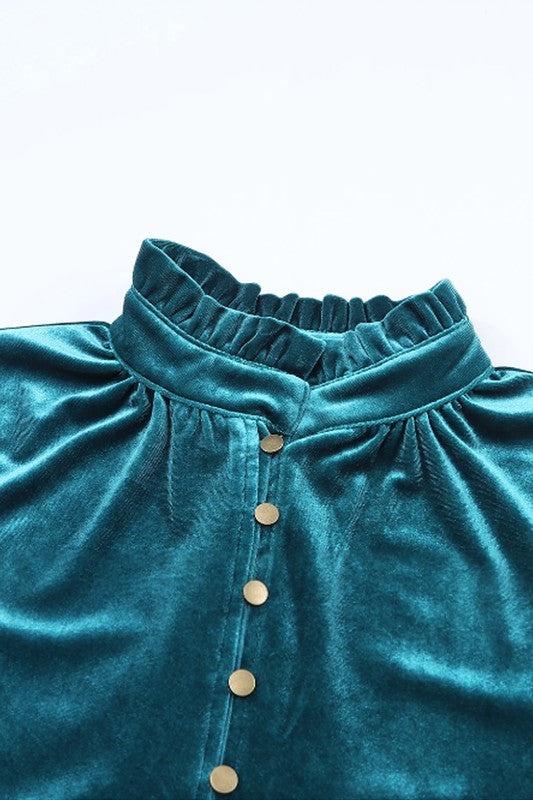 This luxurious velvet blouse is soft, skin-friendly, and lightweight, offering both comfort and elegance. Featuring a classic V-neck, button design, and feminine frilled neckline, it adds a timeless touch to your wardrobe. Perfectly paired with jeans, leggings, skirts, or boots, this versatile top is ideal for any occasion—whether casual, office, or a night out.. Several stunning colors available. All you need to do is pick!