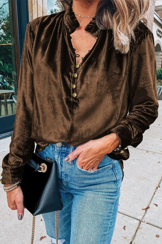 This luxurious velvet blouse is soft, skin-friendly, and lightweight, offering both comfort and elegance. Featuring a classic V-neck, button design, and feminine frilled neckline, it adds a timeless touch to your wardrobe. Perfectly paired with jeans, leggings, skirts, or boots, this versatile top is ideal for any occasion—whether casual, office, or a night out.. Several stunning colors available. All you need to do is pick!