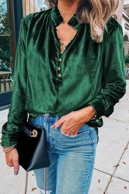This luxurious velvet blouse is soft, skin-friendly, and lightweight, offering both comfort and elegance. Featuring a classic V-neck, button design, and feminine frilled neckline, it adds a timeless touch to your wardrobe. Perfectly paired with jeans, leggings, skirts, or boots, this versatile top is ideal for any occasion—whether casual, office, or a night out.. Several stunning colors available. All you need to do is pick!