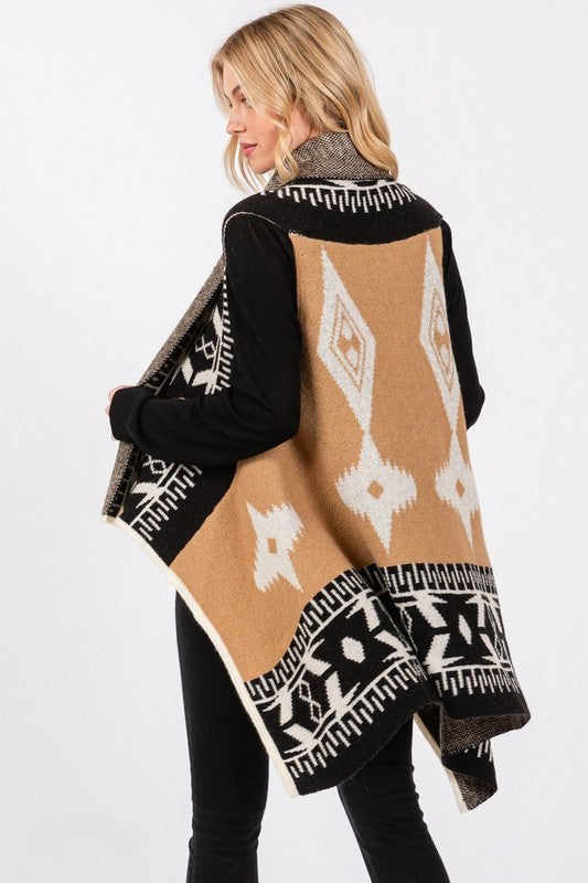 Ready to elevate your boho western style? This Aztec vest is designed to flatter every body shape with a tailored fit that moves with you, offering both comfort and flow. The black, tan, and white Aztec print creates a bold yet timeless look that pairs perfectly with leggings or jeans. Its high-low hem gives you the freedom to dress it up for a night out or keep it casual for a day on the go. Your wardrobe is waiting!