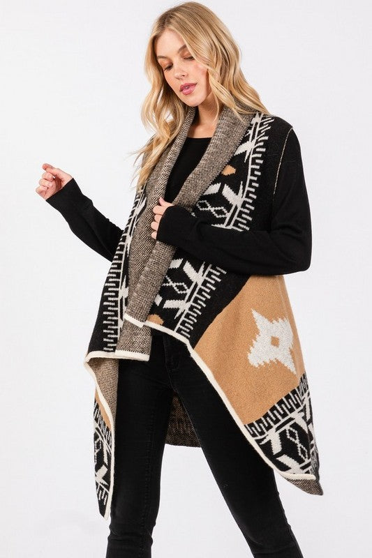 Ready to elevate your boho western style? This Aztec vest is designed to flatter every body shape with a tailored fit that moves with you, offering both comfort and flow. The black, tan, and white Aztec print creates a bold yet timeless look that pairs perfectly with leggings or jeans. Its high-low hem gives you the freedom to dress it up for a night out or keep it casual for a day on the go. Your wardrobe is waiting!