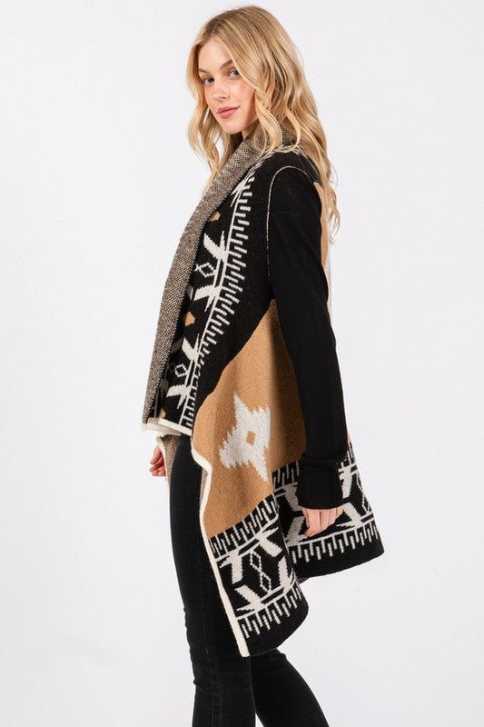 Ready to elevate your boho western style? This Aztec vest is designed to flatter every body shape with a tailored fit that moves with you, offering both comfort and flow. The black, tan, and white Aztec print creates a bold yet timeless look that pairs perfectly with leggings or jeans. Its high-low hem gives you the freedom to dress it up for a night out or keep it casual for a day on the go. Your wardrobe is waiting!