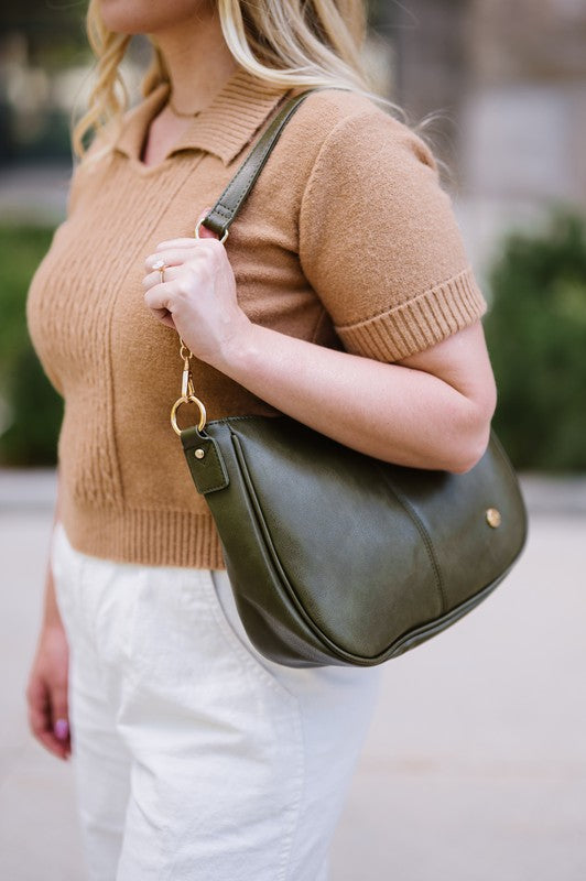 ree Spirit Carryall: Vegan Handbag & Crossbody in Olive with Bonus Straps The Bundle includes a bohemian style crossbody in Olive WITH strap. It also comes with two additional straps: The Evie Strap, and the Garden Party strap. The added interchangeable straps add extra value and can seamlessly change from a handbag to a crossbody! You will also have a stunning VEGAN crossbody made of buttery soft vegan leather and glossy hardware.
