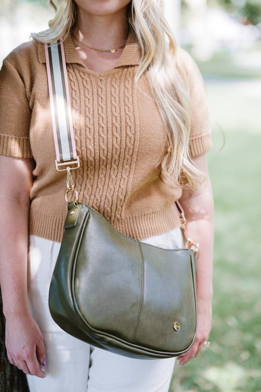 ree Spirit Carryall: Vegan Handbag & Crossbody in Olive with Bonus Straps The Bundle includes a bohemian style crossbody in Olive WITH strap. It also comes with two additional straps: The Evie Strap, and the Garden Party strap. The added interchangeable straps add extra value and can seamlessly change from a handbag to a crossbody! You will also have a stunning VEGAN crossbody made of buttery soft vegan leather and glossy hardware.