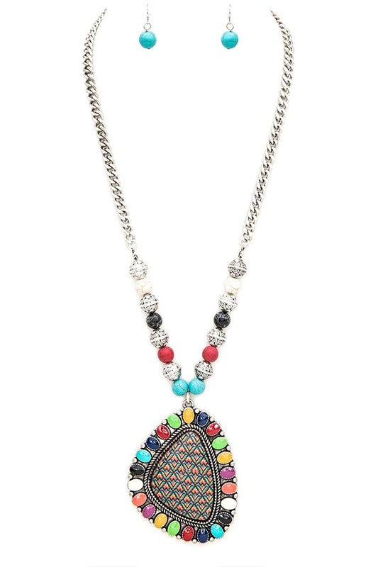 There’s something about a bold pendant that feels like a secret. The kind that’s just waiting to be discovered—maybe on a late-night stroll under the stars, or at that quirky café you've been meaning to try. The Aztec Printed Large Pendant Necklace, with its 24" chain, carries the spirit of adventure. It's the necklace you wear when you're ready to break free from the ordinary and step into something a little more you.