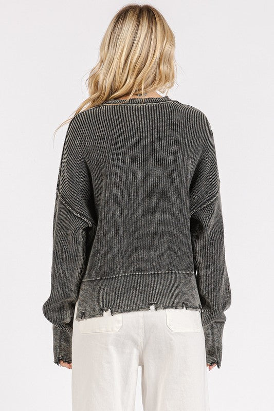 The distressed hem sweater is a relaxed essential for your casual wardrobe. The dropped shoulder design adds a laid-back vibe, while the distressed hem detail gives it a cool and edgy look. The soft knit fabric ensures comfort all day long. Pair it with your favorite jeans or leggings for an effortless ensemble perfect for everyday wear.