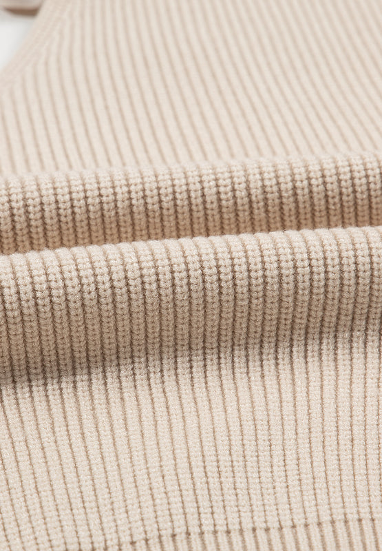 Thick and comfy feminine V-neck sweater. You can choose between (or get both) two gorgeous colors: a creamy beige and a hunter dark green. What else make's this long sleeve different? The feminine tied back bow! This long sleeve sweater can be casual and carefree during the day and dressed up at night. Enjoy the bit of sexy edginess!