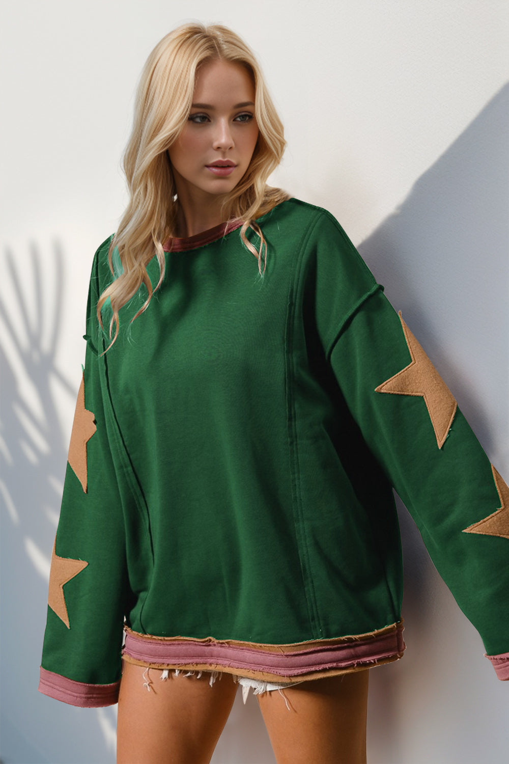 Boho Western Star Patch Sweatshirt – A Little Dust, A Lot of Stars. Add some star power to your sweatshirt collection with this long-sleeve star patched sweatshirt. Made from super-soft cotton, it’s got that laid-back vibe with a slouchy fit, oversized star details, and raw trim for a little extra edge. Whether you’re layering or wearing it solo, this sweatshirt brings effortless cool to any outfit!