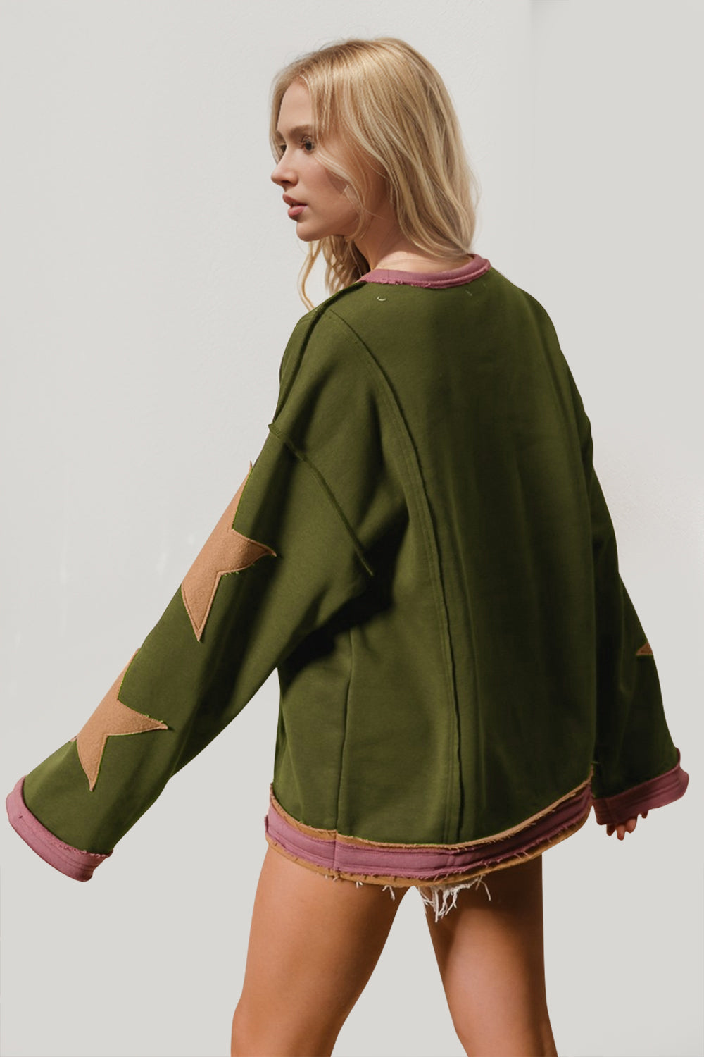 Boho Western Star Patch Sweatshirt – A Little Dust, A Lot of Stars. Add some star power to your sweatshirt collection with this long-sleeve star patched sweatshirt. Made from super-soft cotton, it’s got that laid-back vibe with a slouchy fit, oversized star details, and raw trim for a little extra edge. Whether you’re layering or wearing it solo, this sweatshirt brings effortless cool to any outfit!