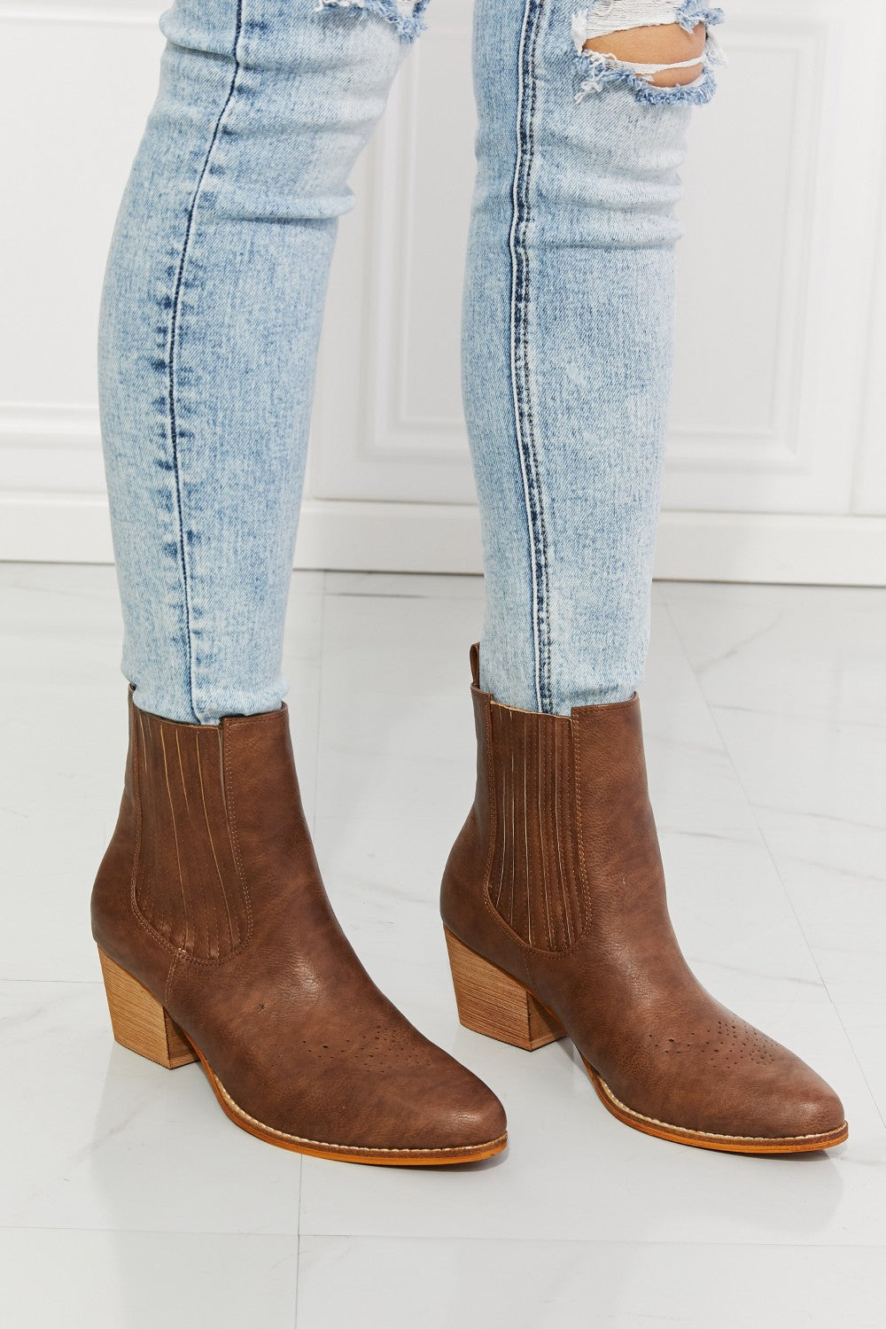 These boots are a balancing act between cowboy boots and Chelsea boots, featuring details of each style. They have a high-top and a stacked heel, as well as an elevated Chelsea panel and pointed toe. You can rock these stacked boots a pair of jeans, a leather jacket, or even a sharp suit. And with their sturdy construction and timeless design, these boots aren't just an accessory—they're an investment in style.