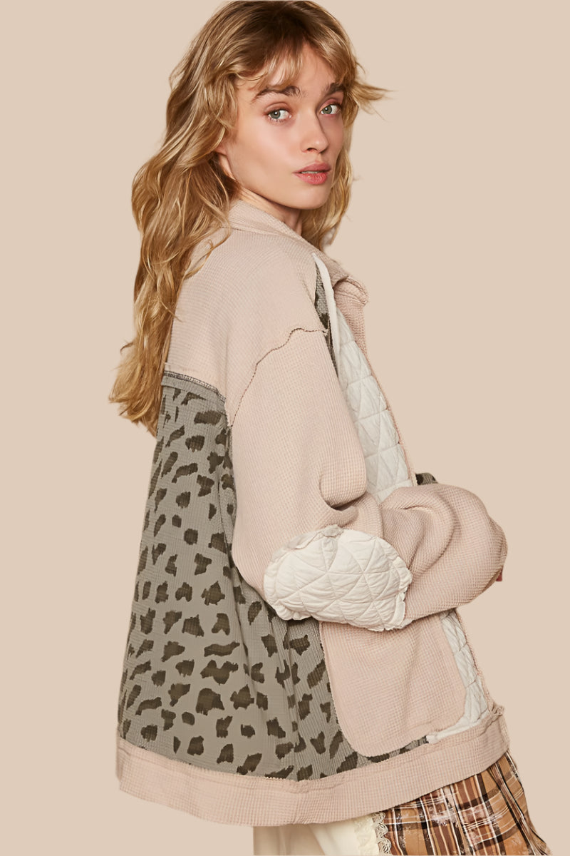 The Leopard, Button Up Quilted Jacket offers creative individual style. This unique design has several features that make it different from your average jacket: quilted and waffle fabrics, elbow patches, exposed seams, a mix of creams, ivory, and leopard prints.