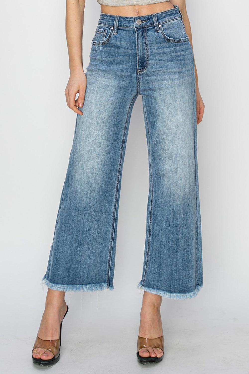 RISEN Wide Leg Jeans-Cropped Jeans- and Raw Hem with Plus Sizes - Boho Perfection. Your other jeans might get jealous.... these have high rise and wide leg and together they can be quite flattering and then add on the edginess of the raw hem detail.
They are a go to classic and have a modern look.. They could easily be your go-to jeans.. Light Wash.