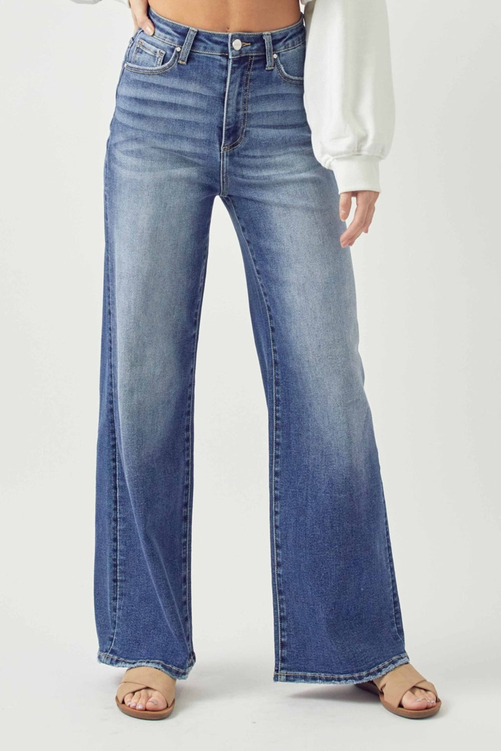 Risen Wide Leg High Rise Jeans with Plus Sizes. A must have boho essential pair of jeans! Wide Leg, High Rise jeans are go-to jeans for any look, any day of the week! Effortless pairing all year long with your boho blouses! Snag you pair before they disappear! Medium wash.