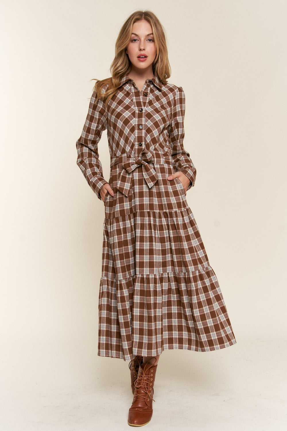 Tiered Midi Shirt Dress -Plaid to Meet You. If you're drawn to the dreamy world of boho, farmcore, or cottagecore, this feminine, prairie-style plaid dress is calling your name. Picture this: flowy fabric that feel like a gentle breeze, vintage-inspired details that make you feel like you've stepped out of a secret garden, and a timeless plaid pattern that just never goes out of style.