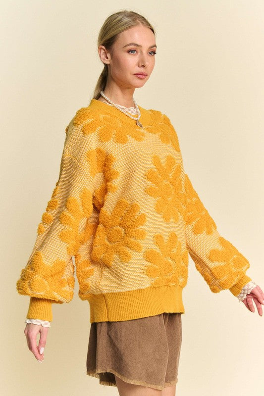 Flower Texture Sweater- The Golden Charm Double-Take. We call this the "Double Take" sweater for a reason. The stunning gold and rich texture are guaranteed to turn heads. The flower texture dropped shoulder sweater is a stylish and comfortable choice for your cool-weather wardrobe. The textured floral pattern is the star of this sweater giving a warm feminine touch. Whether you're heading to work or out for a weekend brunch, this sweater shows off your artistic side while feeling cozy.