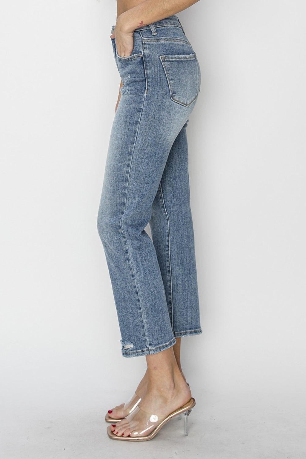 RISEN High Waist Distressed Cropped Jeans- Your Boho Canvas. These are the perfect jeans to express your individuality and your free-spirited creativity! Dive in to curating your unique bohemian look and celebrate self-expression with these jeans as your canvas! medium wash.