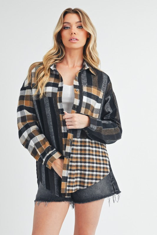 Plaid Button Up Shirt Women's- "Wildwood Plaid Shirt – 100% Cotton, Boho Chic with a Western Twist". The different sized plaid patterns and use of colors gives this plaid shirt a unique non-conventional touch. The button -up has a mix of black, tan, and white colors in a relaxed style that gives of a artistic vibe. It is a top perfect for layering!
