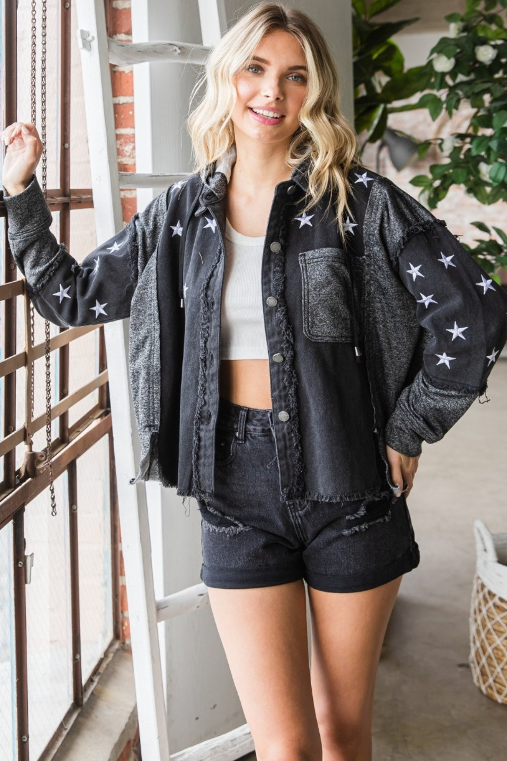 The Star Embroidered Hooded Denim Jacket combines a touch of whimsy with a whole lot of edginess to your wardrobe. Mis-matched materials with raw hem create a textured and eclectic eye-catching denim jacket. (We love this detail BTW). Whether you wear it with jeans for a casual look or layer it over a dress for a more edgy vibe, the Star Embroidered Hooded Denim Jacket is a versatile choice.