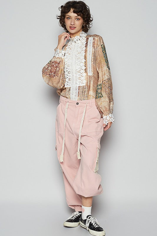 Ready to add a pop of feminine pizzazz to your wardrobe? Meet the "Lace Detail Printed Button-Down Shirt"—where classic meets captivating! This shirt is a mash-up of timeless button-down style and gorgeous lace embellishments that’ll make you feel like you’ve just stepped out of a fashion fairy tale. The lace detailing is like a secret little wink of elegance—prepare for those double-takes!