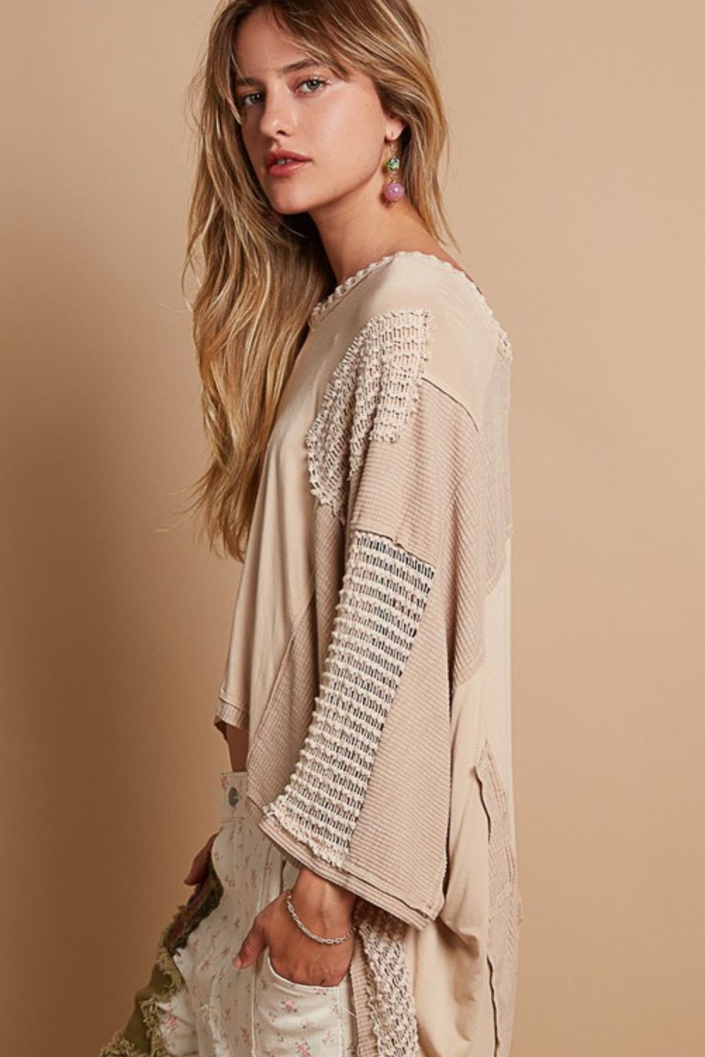 This V-Neck top is the epitome of a carefree bohemian top! It has a dropped shoulder creating a relaxed fit, the frayed edge and open work add texture, the variety of see- through fabrics and asymmetry adds a unique and quirky statement. The high- low style seals the deal with easy going flow and movement. The relaxed fit is all about giving you comfort and ease!