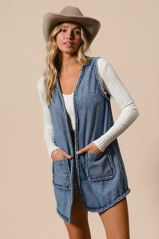 Denim Vest - with Pockets - "Cowgirl Spirit Braided Vest"
The braided vest is a perfect blend of classic Western style and unique craftsmanship. It is not a normal vest, it’s a statement! Featuring intricate braided trim along the edges, it brings a unique touch of rustic charm that sets you apart from the crowd. Are you headed to a rodeo, a concert, or out for a casual day? It adds a sense of adventure to your wardrobe, making you feel ready for anything. Your wardrobe is waiting.