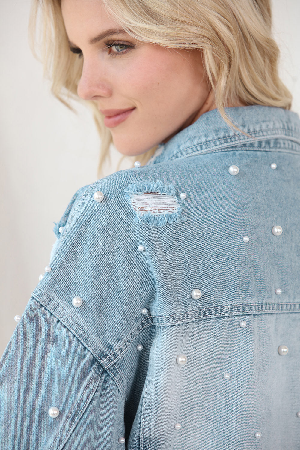 Cropped Denim Jacket and Plus Size - "The Embellished Rebel Pearl". Unleash your free spirit with this cropped jean jacket, where toughness meets elegance. The edgy distressing looks fantastic with the feminine touch of pearls, creating a bold, yet refined look. Whether you're rocking it with denim or a dress, this jacket blends rebellion with grace, giving you the freedom to mix and match your style. It’s the perfect balance of feminine flair and edgy attitude—just the way you like it!