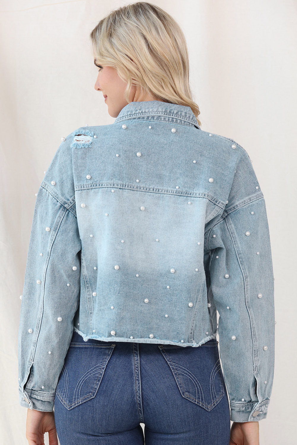 Cropped Denim Jacket and Plus Size - "The Embellished Rebel Pearl". Unleash your free spirit with this cropped jean jacket, where toughness meets elegance. The edgy distressing looks fantastic with the feminine touch of pearls, creating a bold, yet refined look. Whether you're rocking it with denim or a dress, this jacket blends rebellion with grace, giving you the freedom to mix and match your style. It’s the perfect balance of feminine flair and edgy attitude—just the way you like it!