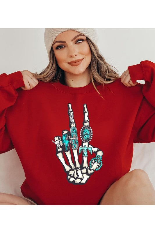 This is a fun year-round graphic sweatshirt with skeleton hand styled with western turquoise jewelry. Comes in multiple colors! Just pick your FAV!
