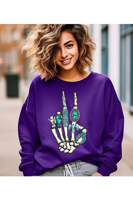 This is a fun year-round graphic sweatshirt with skeleton hand styled with western turquoise jewelry. Comes in multiple colors! Just pick your FAV!