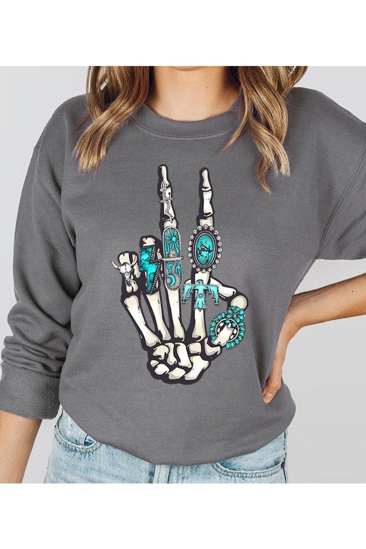 This is a fun year-round graphic sweatshirt with skeleton hand styled with western turquoise jewelry. Comes in multiple colors! Just pick your FAV!