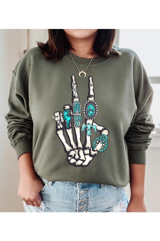 This is a fun year-round graphic sweatshirt with skeleton hand styled with western turquoise jewelry. Comes in multiple colors! Just pick your FAV!