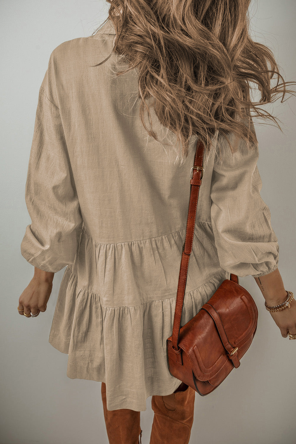 Feel the way this dress moves, (loose and flowy) and you will feel ready to start your day! The tiered style and army green creates a flattering dress that is equal parts free-spirited and laid-back western. The textured ruching along the seams creates a subtle, rippling effect that adds a touch of character to the flowy silhouette. Balloon sleeves bring a playful, whimsical vibe. Designed for comfort and breathability, this dress is perfect for those sunny afternoons or casual get-togethers.