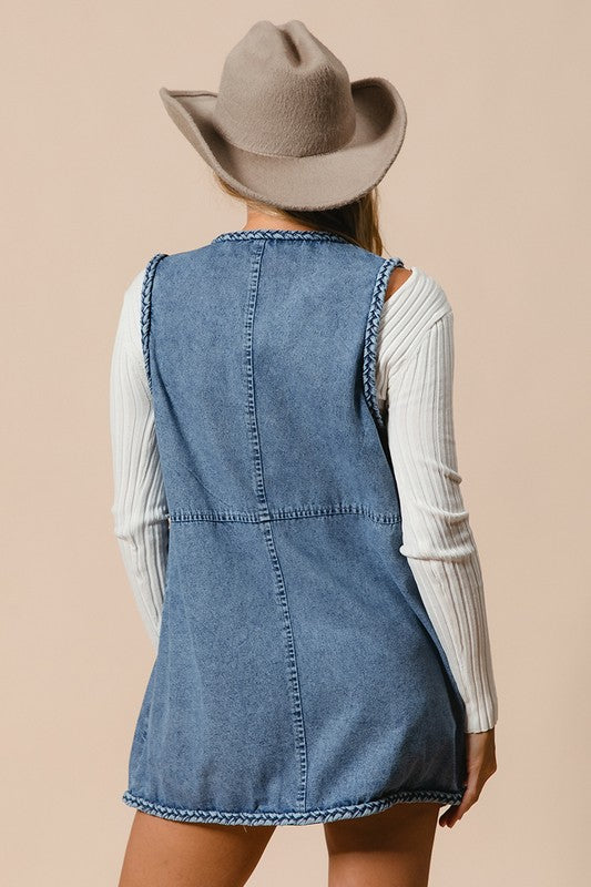 Denim Vest - with Pockets - "Cowgirl Spirit Braided Vest"
The braided vest is a perfect blend of classic Western style and unique craftsmanship. It is not a normal vest, it’s a statement! Featuring intricate braided trim along the edges, it brings a unique touch of rustic charm that sets you apart from the crowd. Are you headed to a rodeo, a concert, or out for a casual day? It adds a sense of adventure to your wardrobe, making you feel ready for anything. Your wardrobe is waiting.