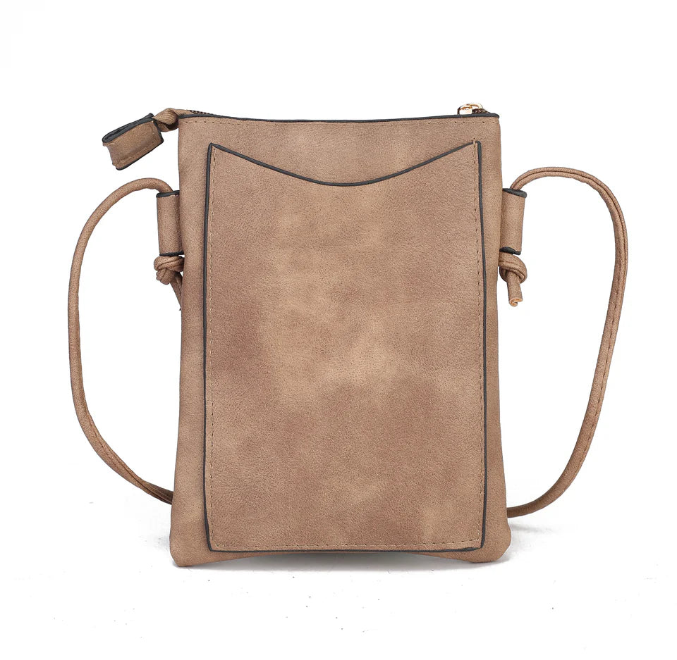 The Sustainable and Sleek Crossbody Bag works perfectly for days when much is not needed to carry to get through the day. Crafted with a supple soft Vegan leather material and gorgeous eyelet design. Roomy enough to fit a phone, keys, and a small wallet comfortably. This bag allows anyone to be hands-free and go about the day with ease and style.