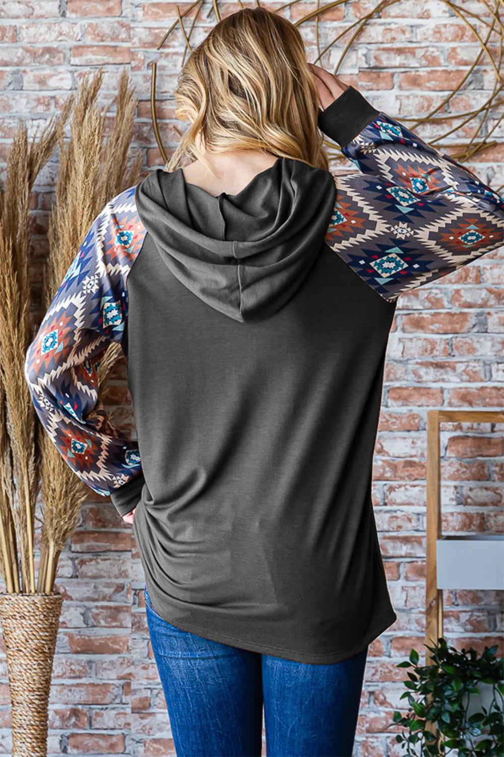Long Sleeve Hooded Top with Aztec Print "The Sleeve Remix" in Charcoal
This shirt is a staff fav here at Free Soul Threads! We couldn’t resist grabbing ours—make sure you snag yours before they’re gone! Limited sizes available, so don’t wait!
SHOUTOUTS:
Level up your shirt collection with a western and Boho style hooded top with contrast sleeves for an extra pop of dimension!